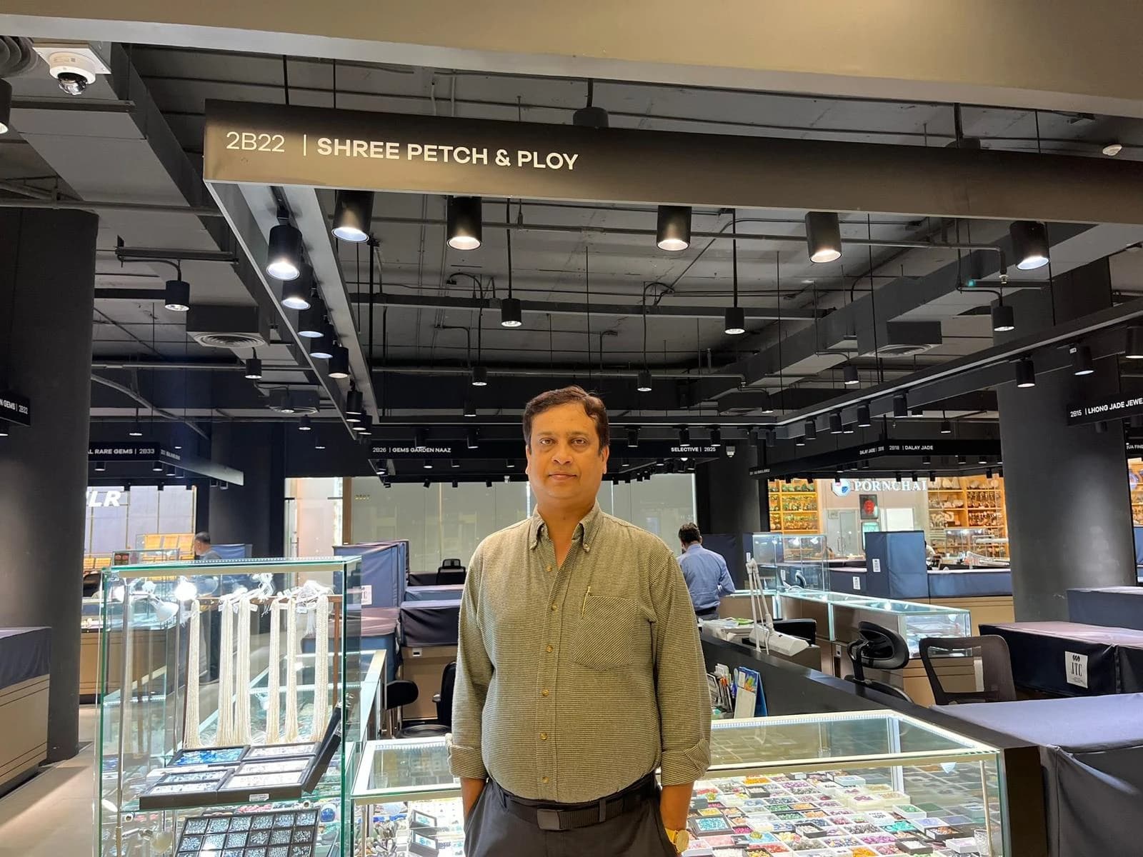 Gajendra Kumar Munot, founder of Shree Petch & Ploy, at the company's booth in the Jewelry Trade Center, Bangkok